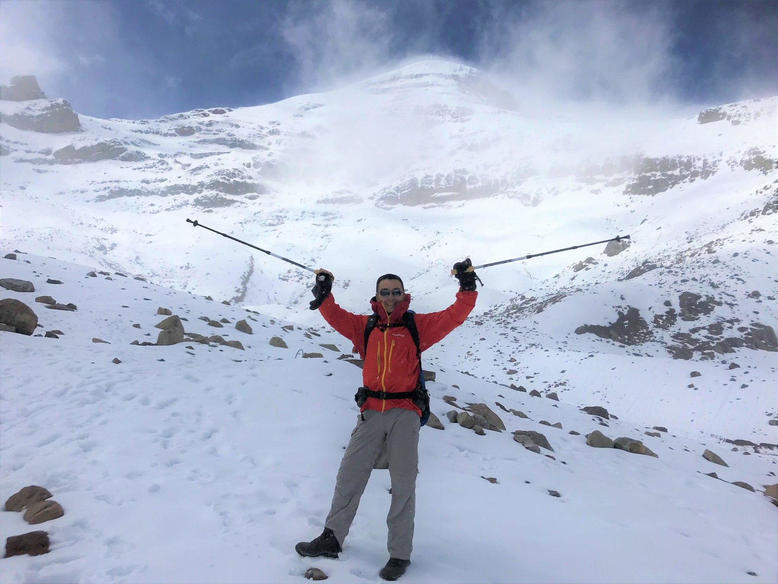 Executive summiting a mountain symbolizing AI-driven business transformation leadership journey